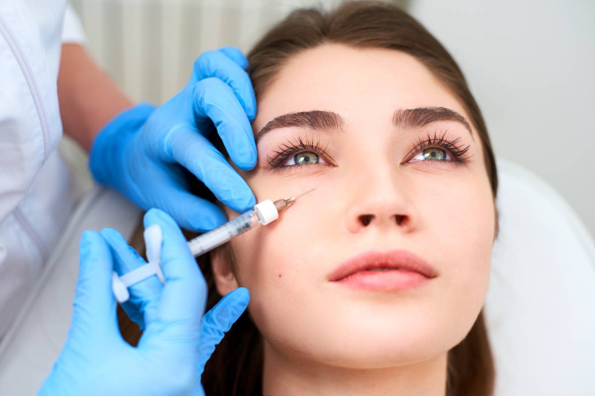 Woman getting fillers after Botox.